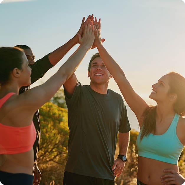 Friends, group and high five or outdoor exercise on mountain for trail running, support or fitness. Men, women and hand gesture for training goals or sport target or celebration, morning or nature; Shutterstock ID 2460004047; purchase_order: -; job: -; client: -; other: -